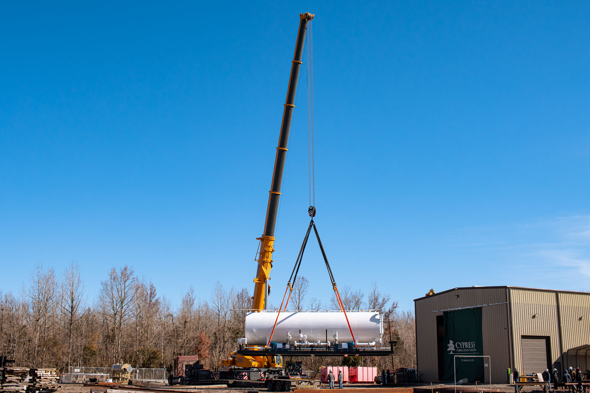 Large crane moving ASME pressure vessel into Cypress Fabrication's ASME Certified Facitlity